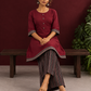 Timeless Maroon Ajrakh Cotton Co-Ord Set with Contrast Printed Border Tunic & Matching Geometric Pattern Farshi Salw — seated
