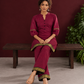 Elegant Maroon Silk Co-Ord Set with Contrast Black & Gold Border Detailing on Hem and Sleeves — seated