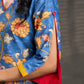 Indigo Kalamkari printed dress with vibrant red and mustard accents.