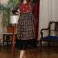 Black ajrakh flared dress with zari work and georgette hemline