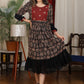 Black ajrakh flared dress with zari work and georgette hemline
