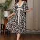 Floral print V neck gathered dress with attached belt and coin embellishments