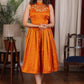 Exclusive orange gathered cotton silk dress with turtle neck and floral embroidery