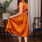 Exclusive orange gathered cotton silk dress with turtle neck and floral embroidery