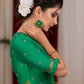 Emrald green cotton silk blouse with overall mirror embroidery highlighted with banarasi lace