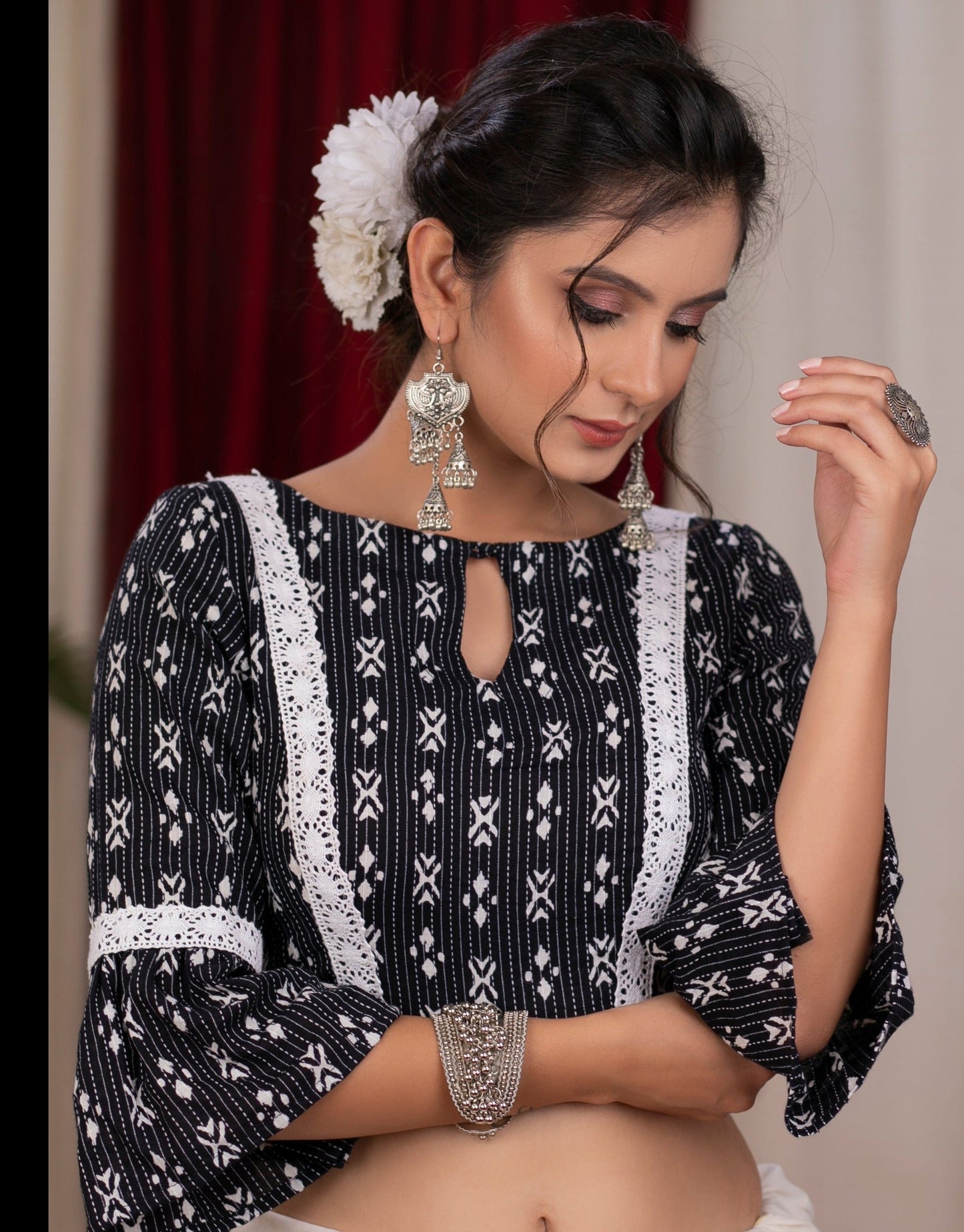 Standout kantha print navy blue blouse with bell sleeve highlighted with macrame lace