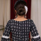 Standout kantha print navy blue blouse with bell sleeve highlighted with macrame lace