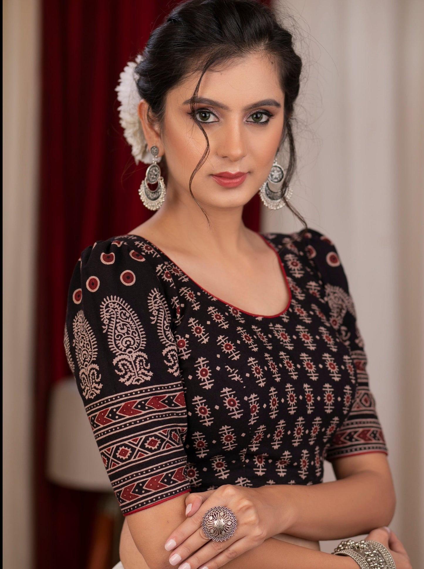 Black ajrakh blouse with puff paisley motifs on sleeves