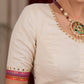 Elegant ivory cotton blouse with overall hand embroidered madhubani motif