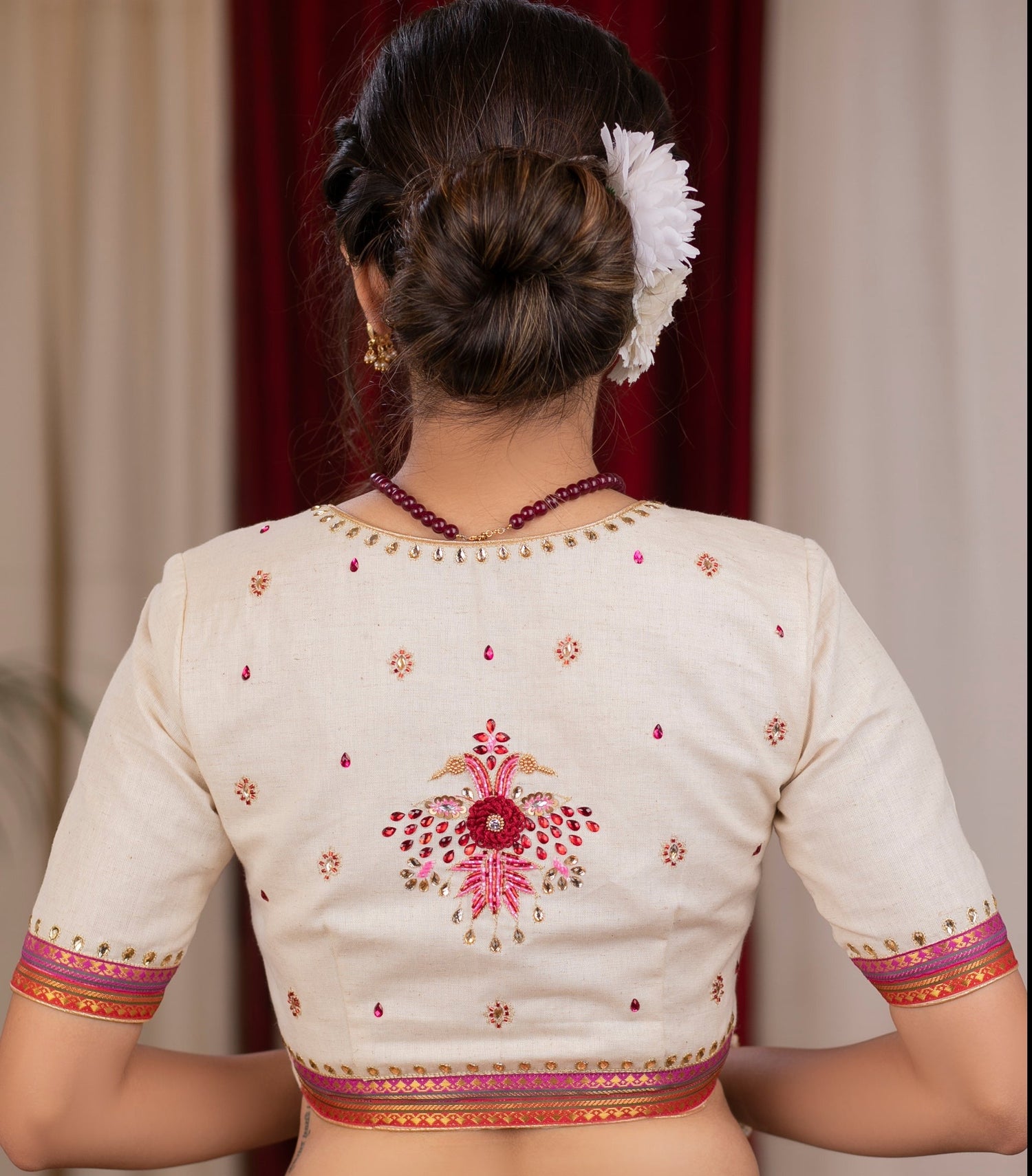 Elegant ivory cotton blouse with overall hand embroidered madhubani motif
