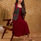 Sharp dark teal and maroon checkered sleeveless jacket with a distinctive notch collar and princess-cut tailoring, offering a structured silhouette ideal for elevated corporate styling.