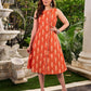 Statement orange Ikat side-wrap dress elevated with scalloped edges and subtle cream accents.