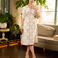 Soft off-white block printed rayon dress with intricate all-over hand block printed checks and florals, a gently gathered yoke, and rich red accents for a refined, elegant everyday look.