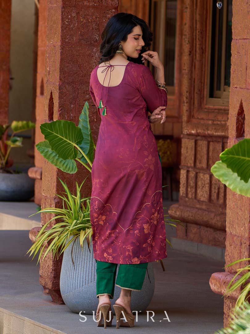Exquisite deep burgundy printed kurta with intricate neck panel embroidery, delicate green beads, and refined green highlights.