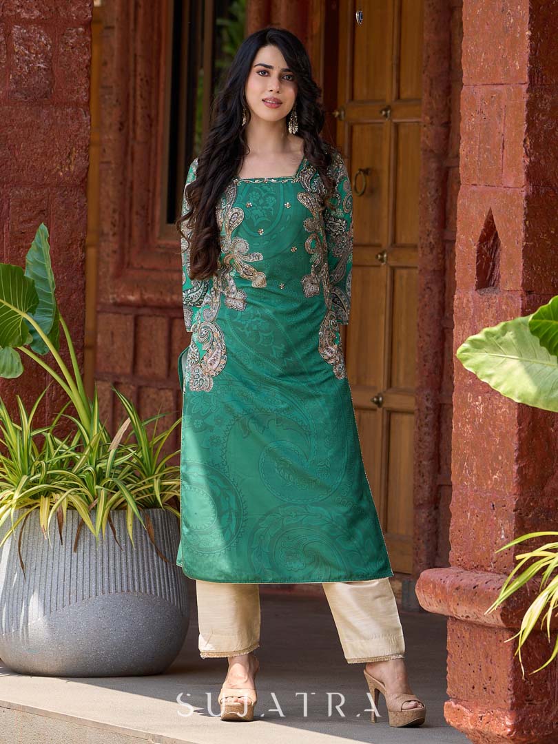 Statement green paisley kurta with detailed hand embroidery beautifully enhancing the print.