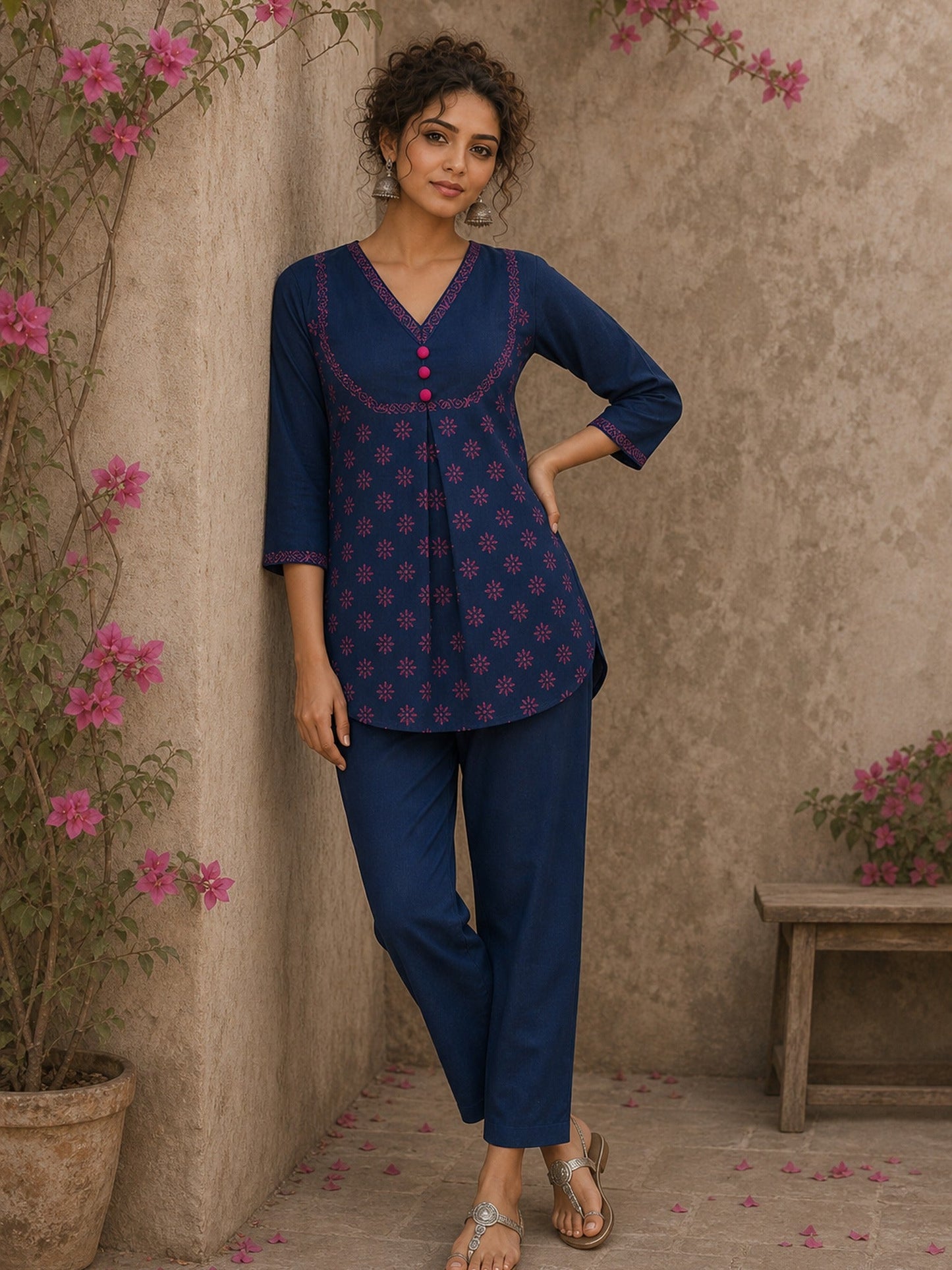 Vibrant navy blue and pink hand block print top features bell sleeves, floral detailing, and rich navy hues for effortless everyday charm.