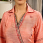 Peach dress featuring delicate Madhubani painting and graceful flared sleeves.