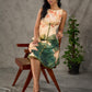 Statement Cream lotus motif dress with earthy olive accents.