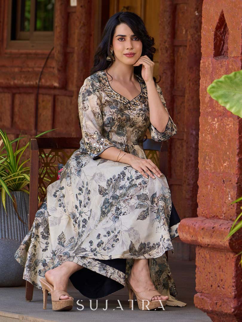 Elegant black–white floral kurta featuring a graceful bias silhouette, intricate mirror embroidery on the neck and sleeves, and a sweetheart neckline.