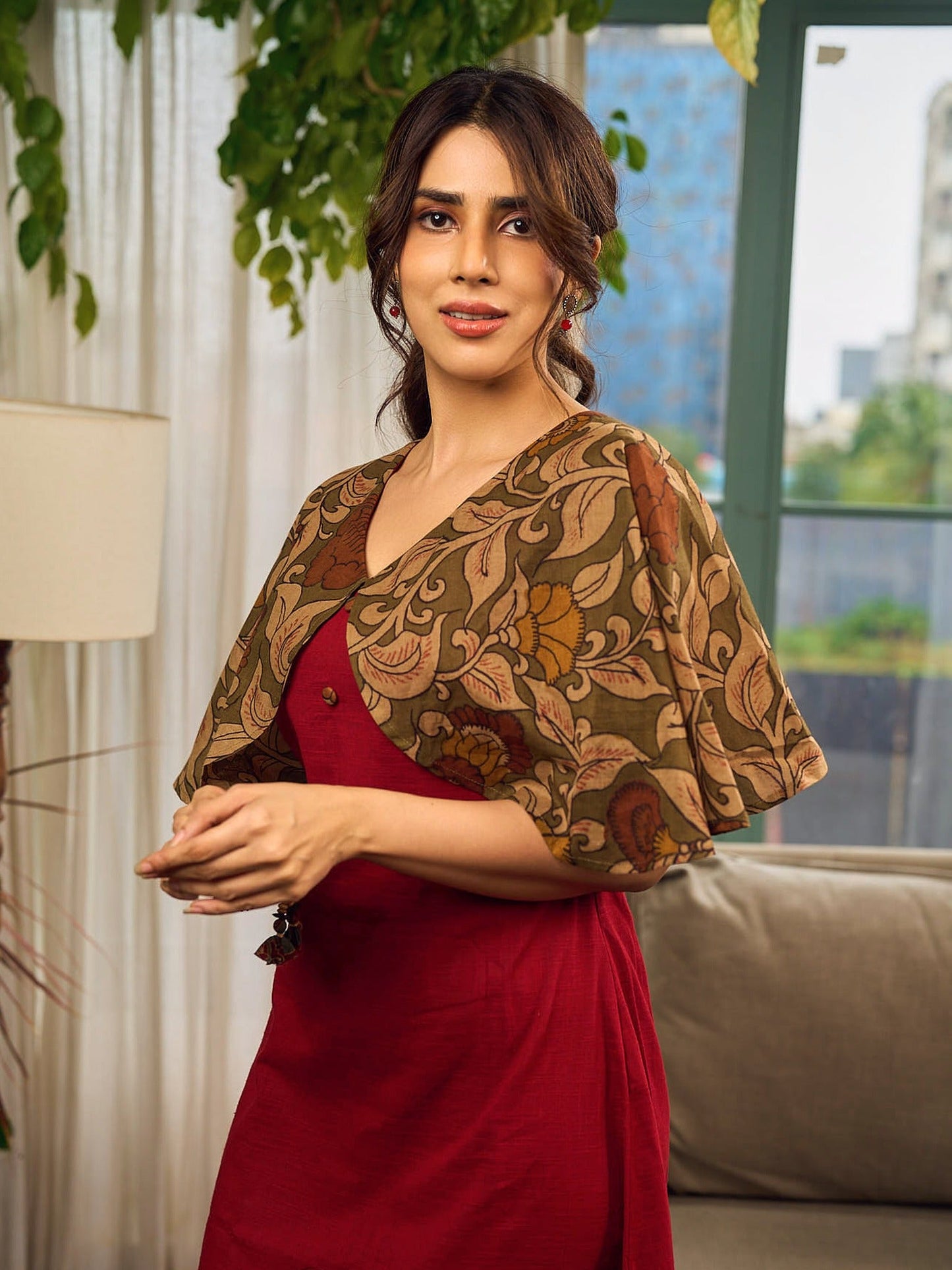 Elegant maroon dress featuring an attached artisan Kalamkari shoulder cape.