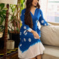 Refreshing cobalt blue shibori tie-dye dress with ivory accents and delicate lace-trimmed neckline.