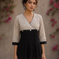 Black Jaipur floral printed yoke top featuring black pintuck body, three-quarter sleeves, and delicate ruffled sleeve edging.