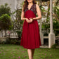 Statement sleeveless Ajrakh dress elevated with a folded collar and graceful maroon pleats.