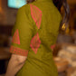 Gorgeous olive dress with pink abstract triangle hand block prints placed at the centre, sleeves, and back, featuring a mandarin collar and half sleeves for a refined, contemporary look.