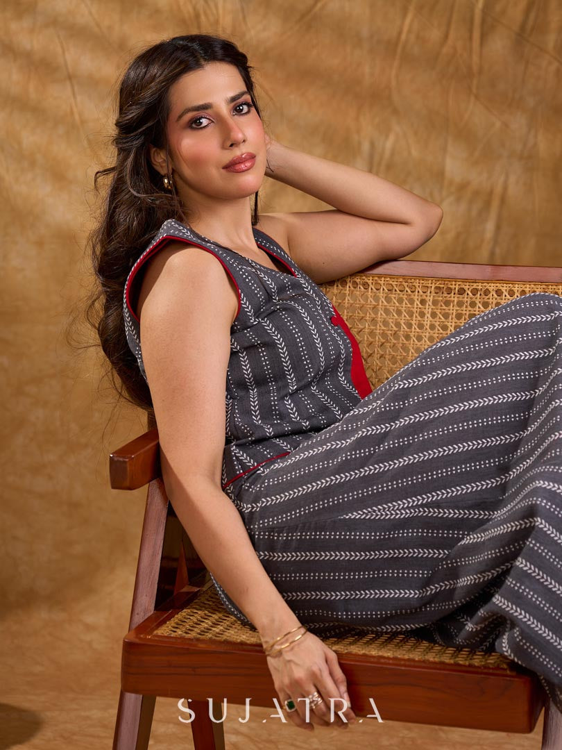 Textured grey Jamdani sleeveless waistcoat with bold red accents and an asymmetrical opening, creating a sharp, modern silhouette with distinctive, fashion-forward appeal.