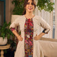 White and black striped dress with Kalamkari panel and tie-up neckline.