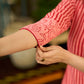 Peach and red block print stripe-floral shirt dress with fusion hand block printed stripes and jaal, a notch collar, and coordinated red accents for a vibrant, contemporary look.