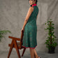 Bottle green Madhubani printed dress with vibrant magenta accents.