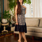 Stunning black Kalamkari overlap dress featuring a chic asymmetrical gathered hem.