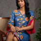 Indigo Kalamkari printed dress with vibrant red and mustard accents.