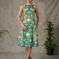 Green peacock motif printed dress with straight neckline and orange accents