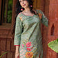 Soft green printed kurta with vibrant floral motifs, highlighted with hand embroidery and bright magenta accents.