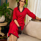 Elegant red dress featuring delicate, hand-painted Madhubani lotus motif detailing.