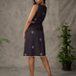 Black digital printed sleeveless dress with straight printed strip neckline and beige accents