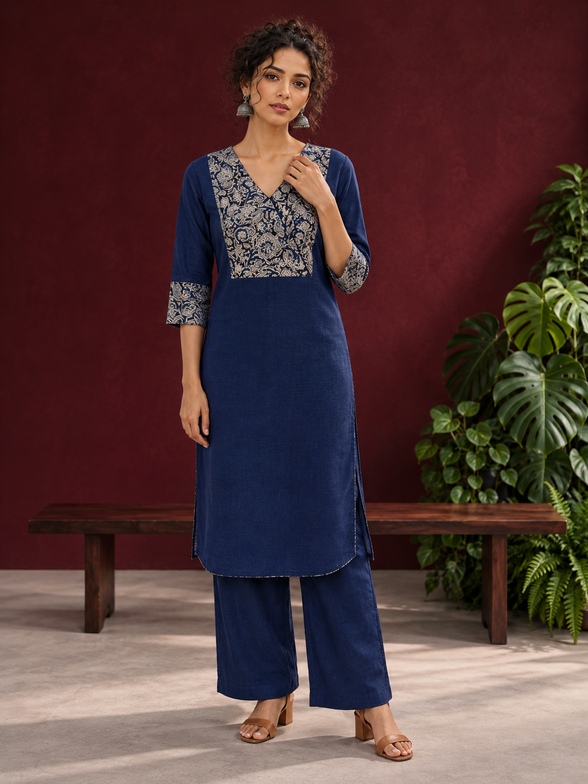 Elegant Navy Blue Kurta with Contrast Kalamkari Print Yoke and Matching Sleeve Cuffs — front view