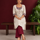Timeless Off-White Cotton Kurta with Handpainted Madhubani overlapping Neckline & Matching Sleeve Cuffs — seated