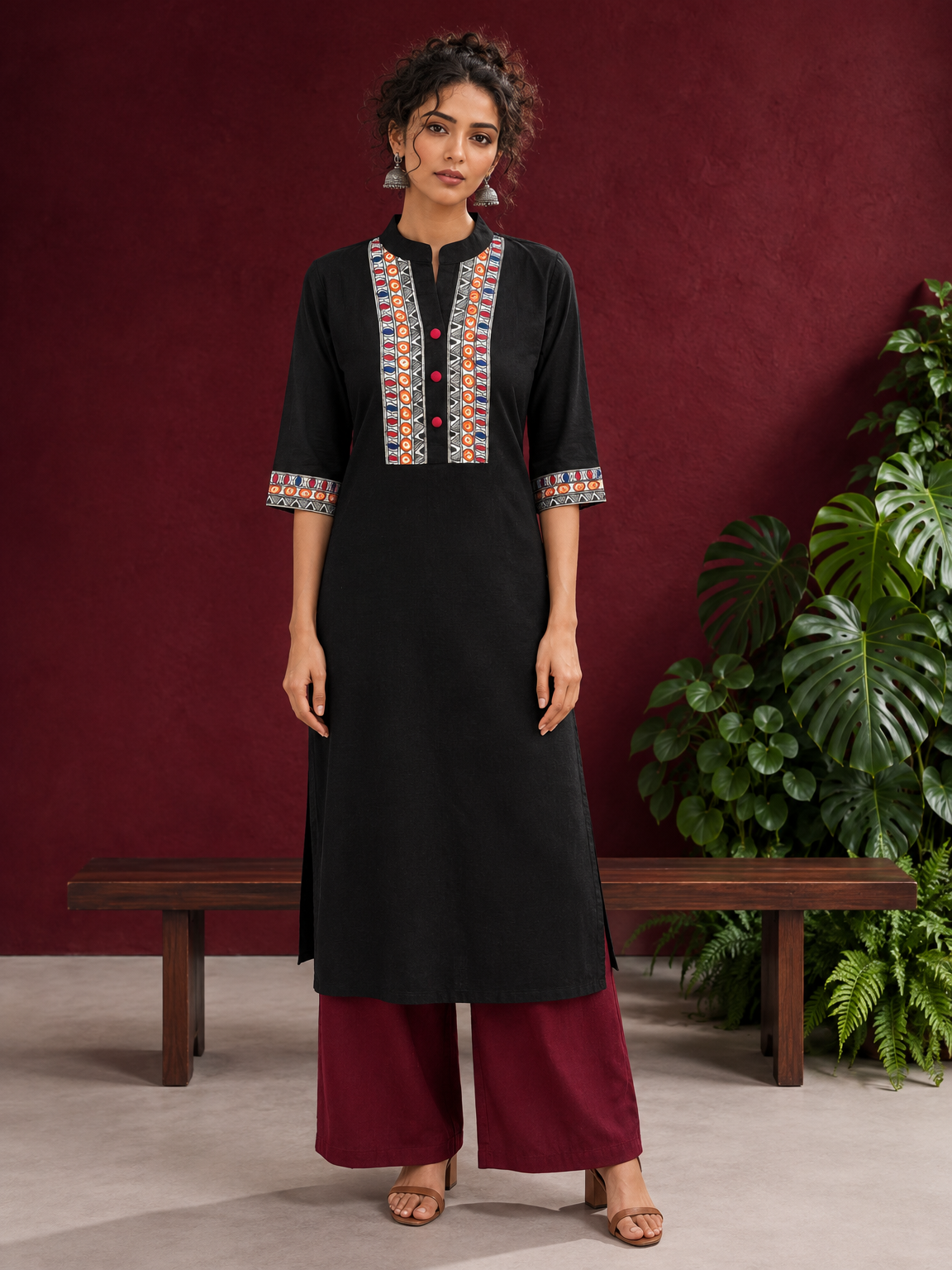 Classic Black Cotton Kurta with hand painted Madhubani neck panels & Matching Sleeve Cuffs — front view