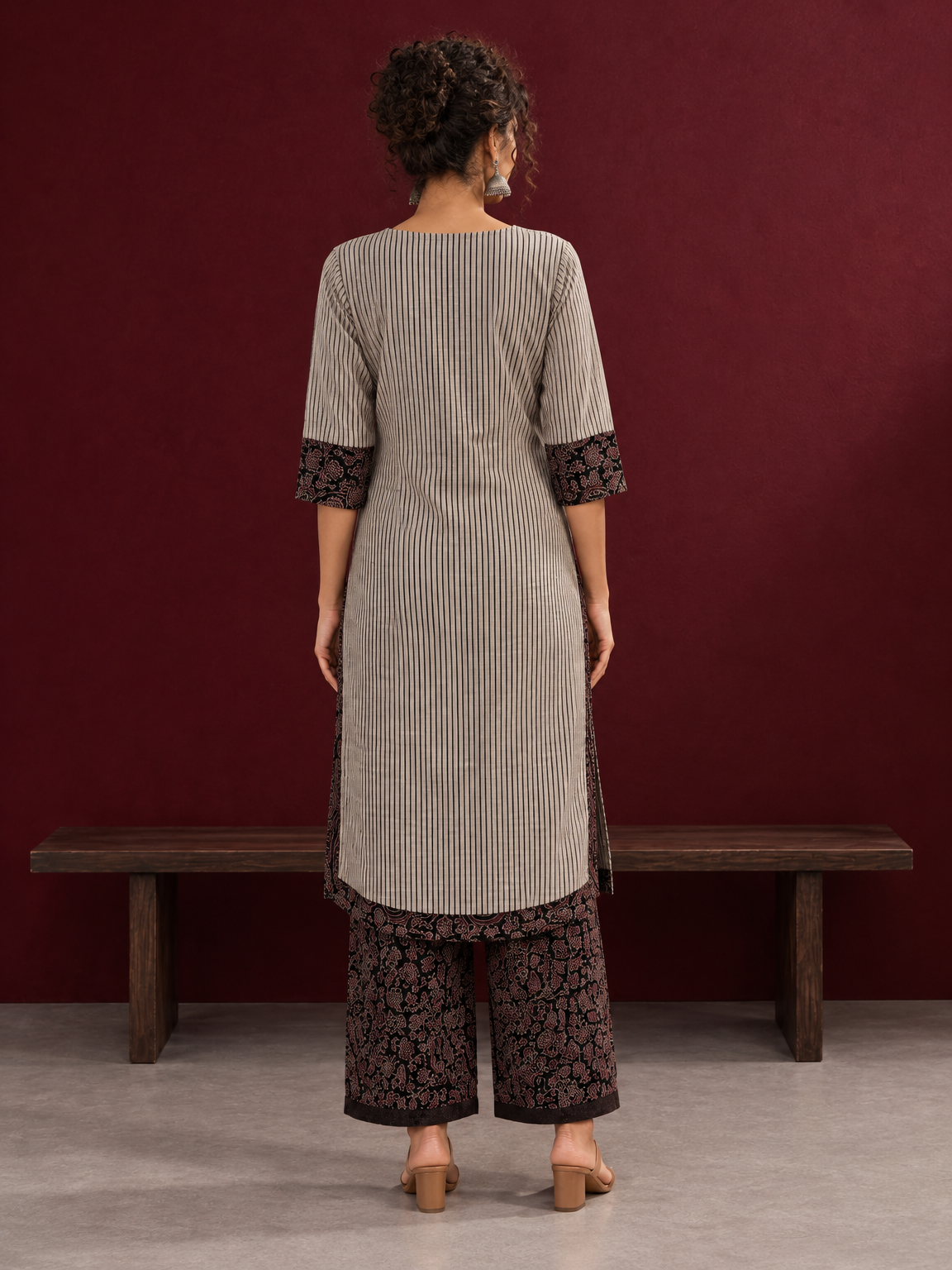 Elegant Beige Ajrakh Striped Cotton Kurta with Contrast Black Floral patch in Neckline & Sleeve Cuffs — back view