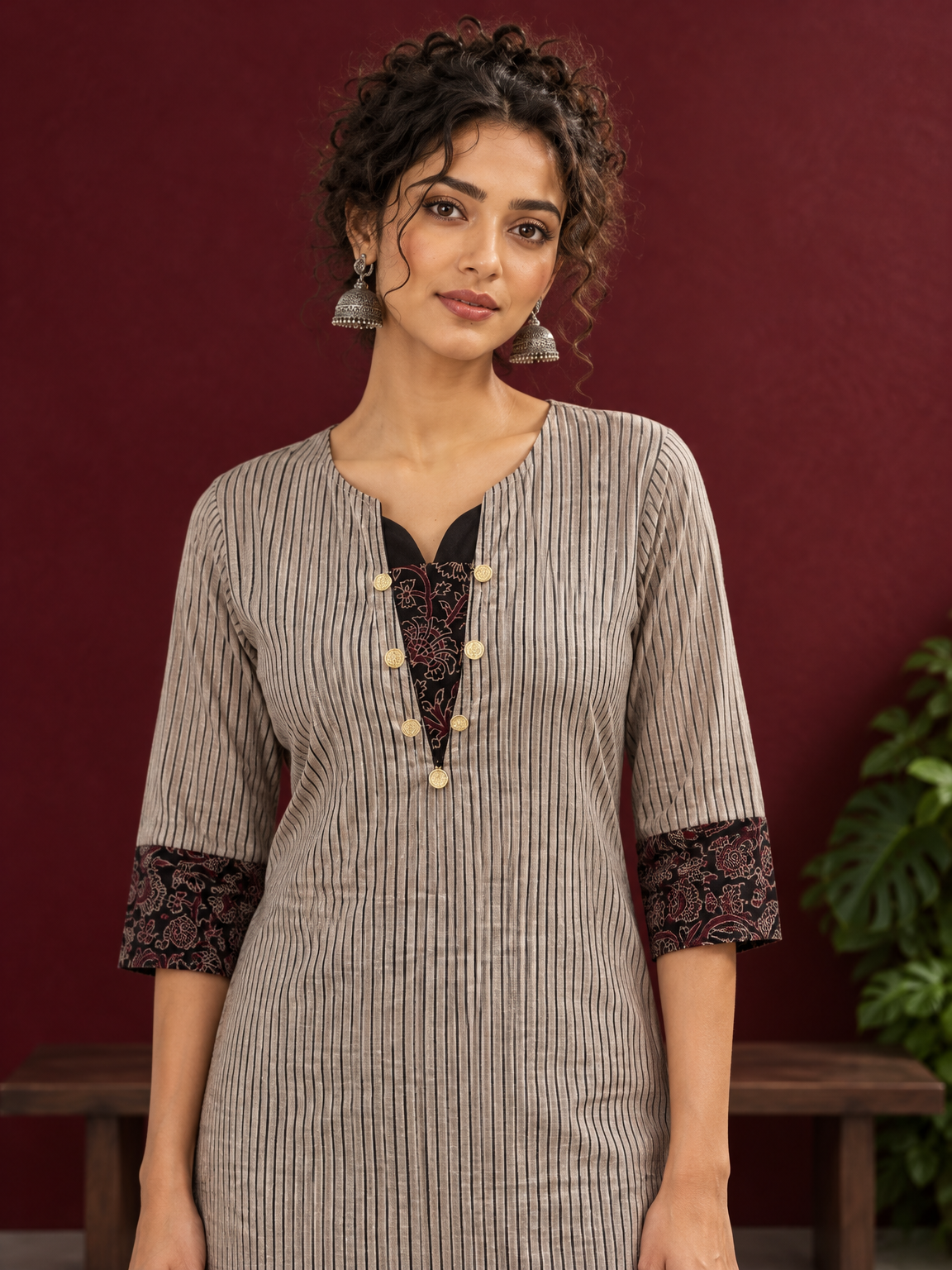 Elegant Beige Ajrakh Striped Cotton Kurta with Contrast Black Floral patch in Neckline & Sleeve Cuffs — styled view