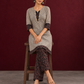Elegant Beige Ajrakh Striped Cotton Kurta with Contrast Black Floral patch in Neckline & Sleeve Cuffs — seated