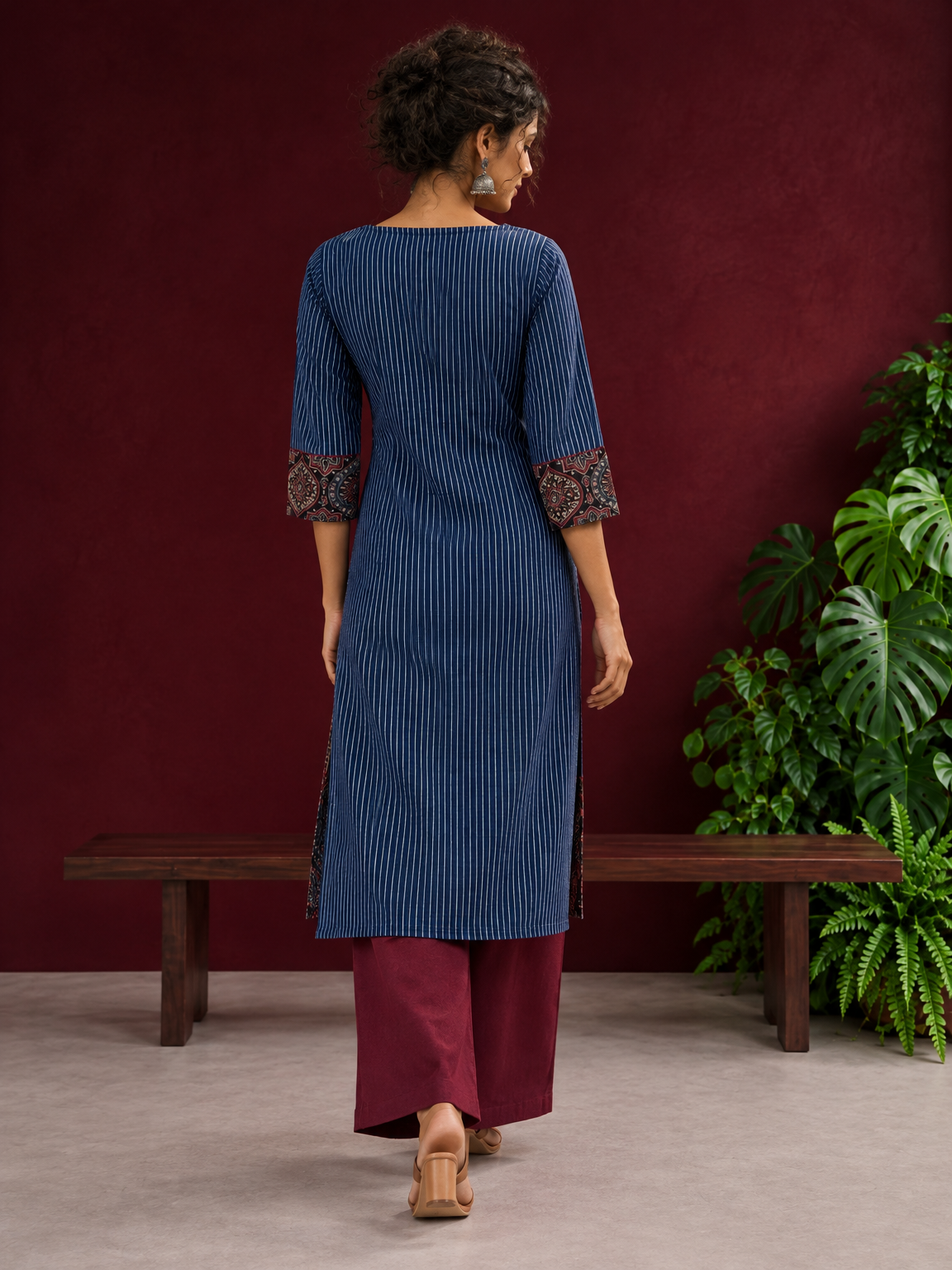 Navy Blue Ajrakh Striped Cotton Kurta with Contrasting Maroon Ajrakh Print Hemline and Sleeve Cuffs — back view