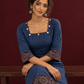 Navy Blue Ajrakh Striped Cotton Kurta with Contrasting Maroon Ajrakh Print Hemline and Sleeve Cuffs — seated detail