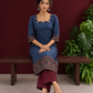 Navy Blue Ajrakh Striped Cotton Kurta with Contrasting Maroon Ajrakh Print Hemline and Sleeve Cuffs — seated