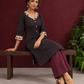 Black Polka Dot Kurta with Ajrakh Printed Beige Collar and Contrast Cuffs — seated