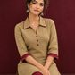 Timeless Beige Cotton Asymmetric Kurta with Maroon Lace Collar and Contrast Maroon Accent — seated detail