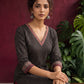 Classic Black Polka Dot Kurta with Contrast Zig-Zag Ajrakh V-Neck With Ajrakh Border On Cuffs — seated detail
